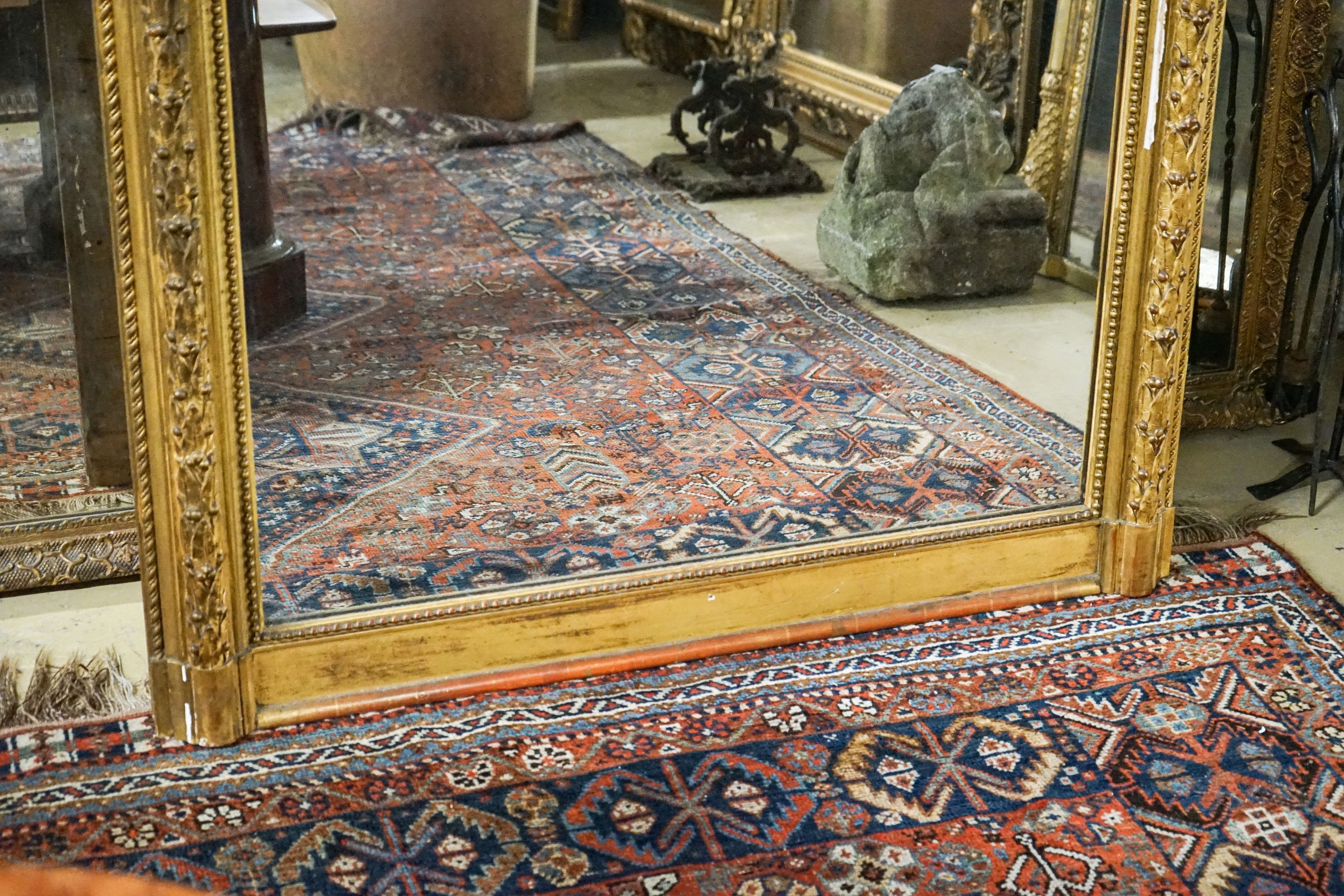 A Victorian giltwood and gesso overmantel mirror with arched scroll pediment, width 112cm, height 180cm